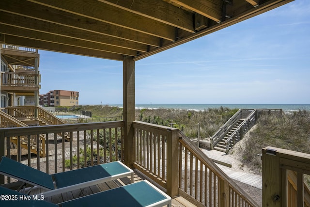 1774 New River Inlet Rd Unit 5, North Topsail Beach, NC 28460 - wooden deck featuring a view of the beach, stairway, and a water view