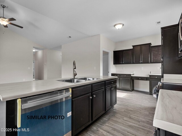 139 Tides End Dr, Holly Ridge, NC 28445 - kitchen featuring light wood finished floors, stainless steel dishwasher, a sink, a ceiling fan, and light countertops