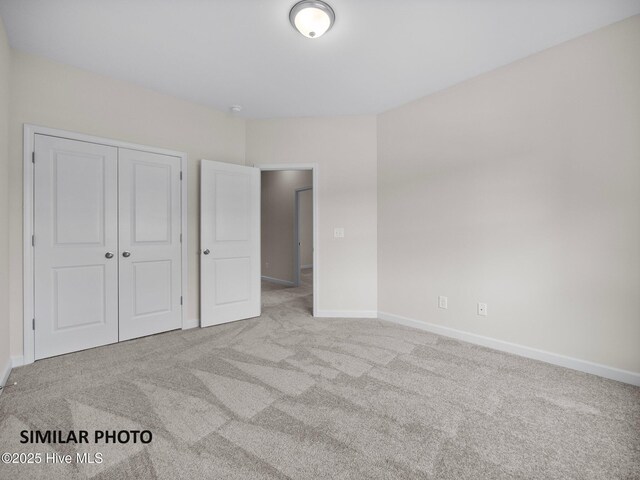 139 Tides End Dr, Holly Ridge, NC 28445 - unfurnished bedroom featuring carpet floors, a closet, and baseboards
