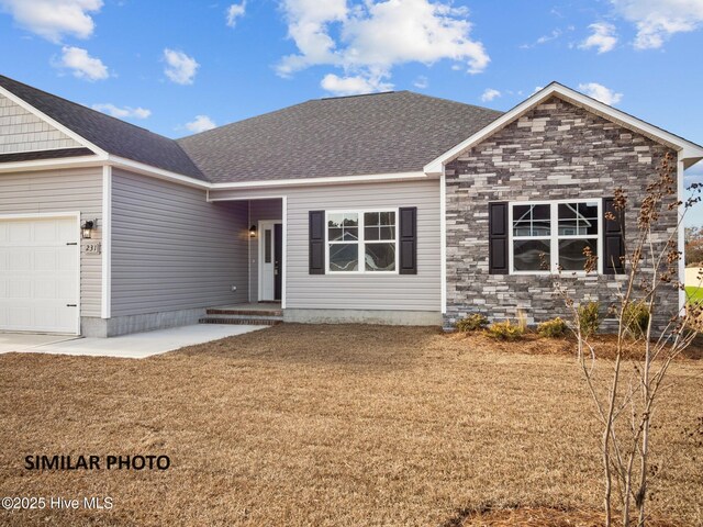 139 Tides End Dr, Holly Ridge, NC 28445 - single story home with a front lawn, stone siding, and a garage