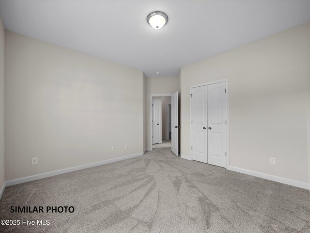 139 Tides End Dr, Holly Ridge, NC 28445 - unfurnished bedroom with a closet, carpet flooring, and baseboards