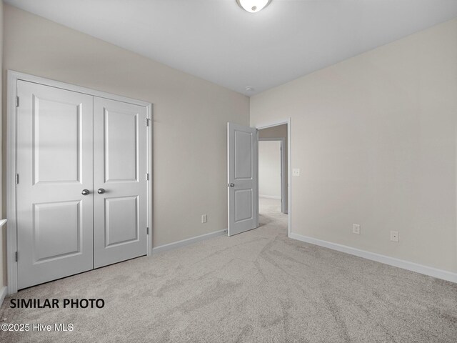 139 Tides End Dr, Holly Ridge, NC 28445 - unfurnished bedroom with baseboards, carpet flooring, and a closet