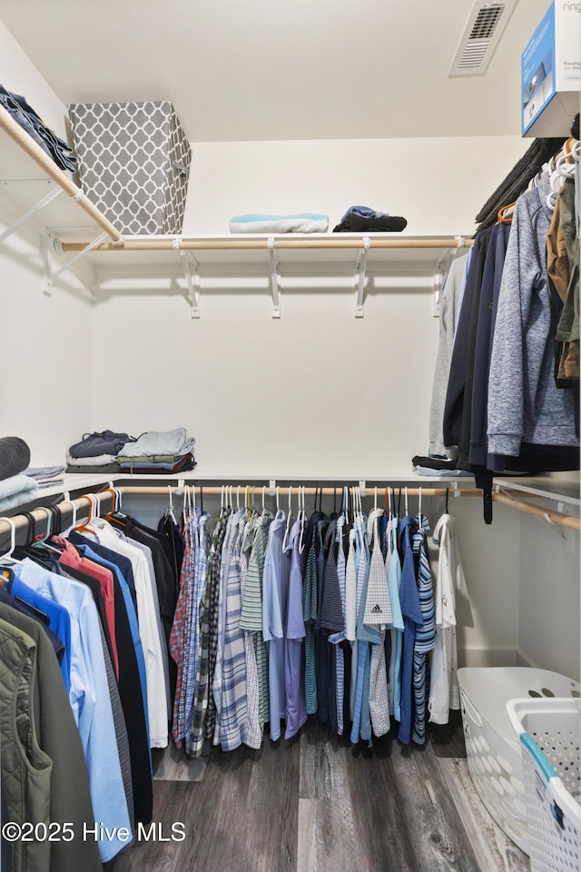 spacious closet with visible vents and wood finished floors