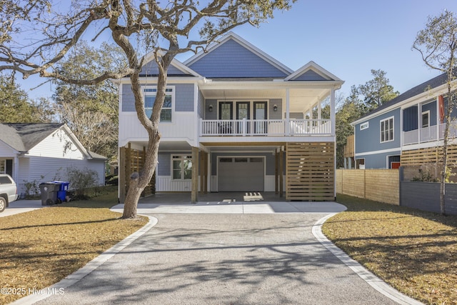 view of front of house featuring fence and driveway