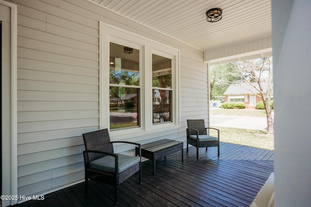 wooden deck featuring covered porch