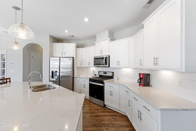 2226 Jasper Forest Trl, Winnabow, NC 28479 - kitchen featuring stainless steel appliances, a sink, backsplash, white cabinetry, and recessed lighting