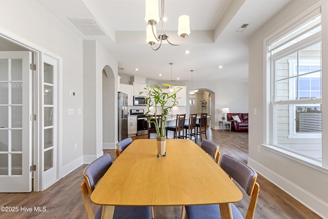 2226 Jasper Forest Trl, Winnabow, NC 28479 - dining room featuring arched walkways, healthy amount of natural light, dark wood-style floors, baseboards, and recessed lighting