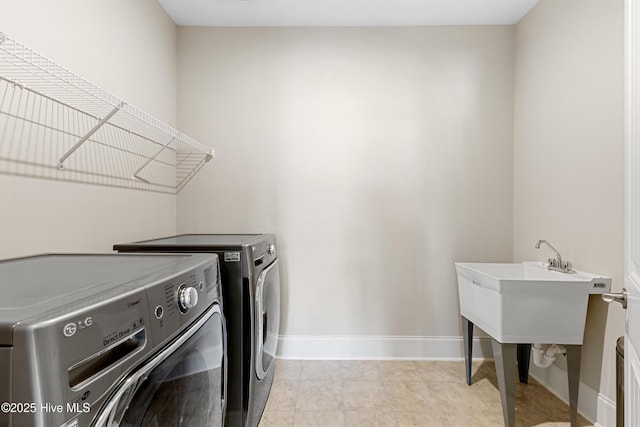 2226 Jasper Forest Trl, Winnabow, NC 28479 - washroom featuring separate washer and dryer and baseboards
