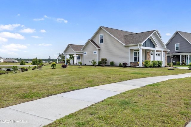2226 Jasper Forest Trl, Winnabow, NC 28479 - craftsman inspired home featuring a front lawn, a garage, board and batten siding, roof with shingles, and stone siding