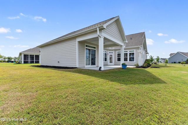 2226 Jasper Forest Trl, Winnabow, NC 28479 - back of property with a patio area, a yard, and a shingled roof