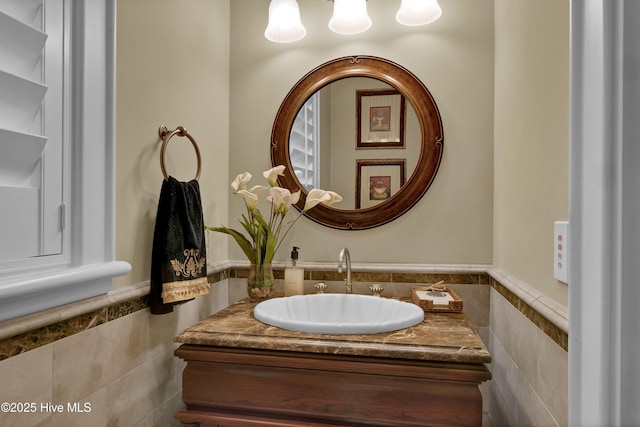 bathroom featuring vanity, tile walls, and a wainscoted wall
