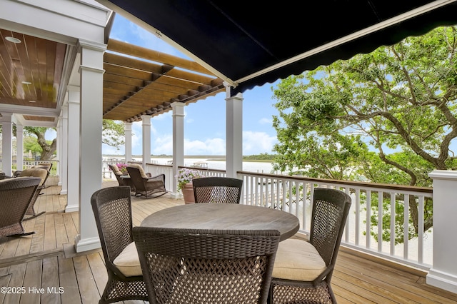 wooden deck featuring a water view