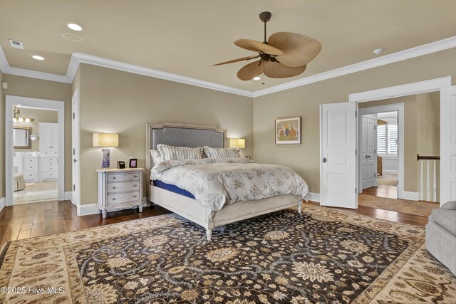 bedroom with crown molding, baseboards, ceiling fan, and hardwood / wood-style floors