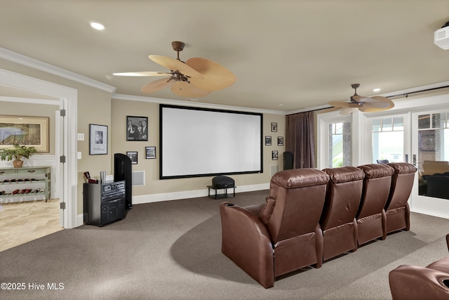 carpeted home theater featuring baseboards, ornamental molding, a ceiling fan, and recessed lighting
