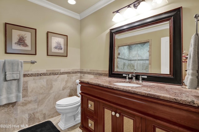 full bath with crown molding, walk in shower, vanity, toilet, and tile walls