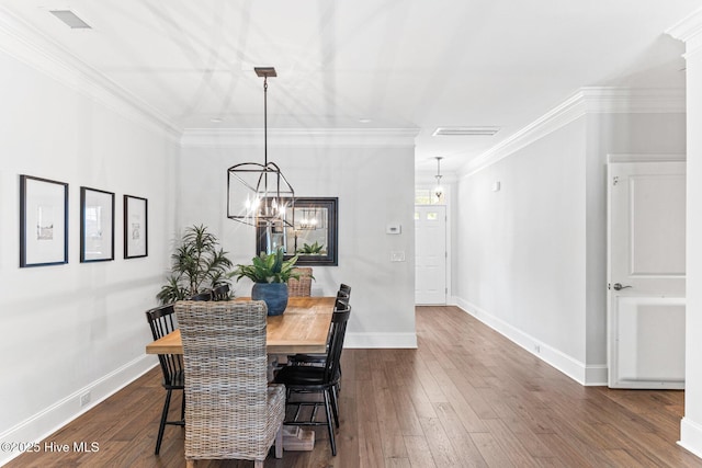 dining room featuring baseboards, a notable chandelier, dark wood finished floors, and visible vents