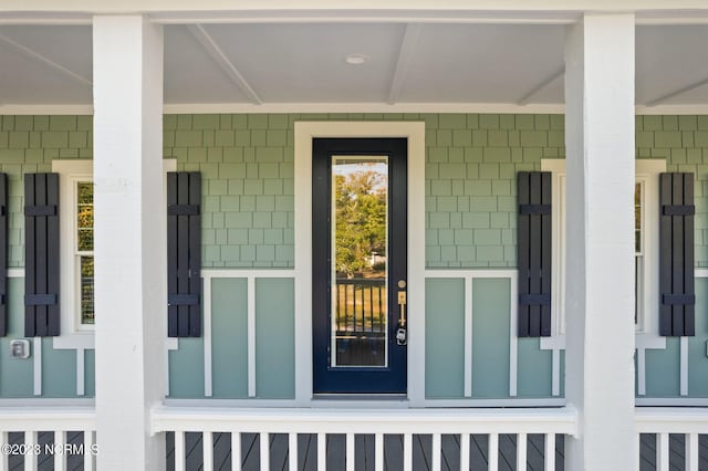 doorway to property featuring a porch