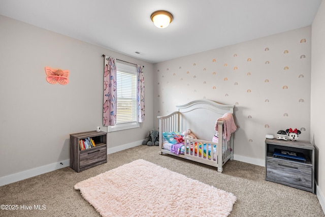 bedroom with carpet, visible vents, and baseboards