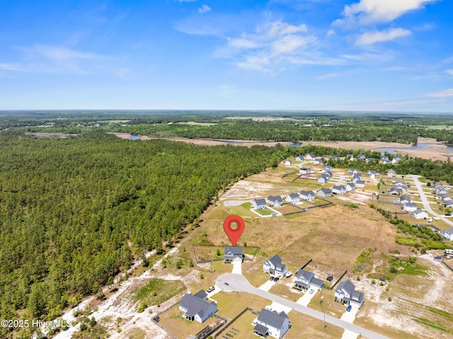 aerial view with a forest view and a residential view