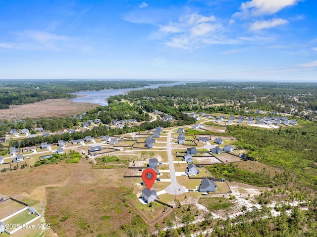 birds eye view of property featuring a water view and a residential view