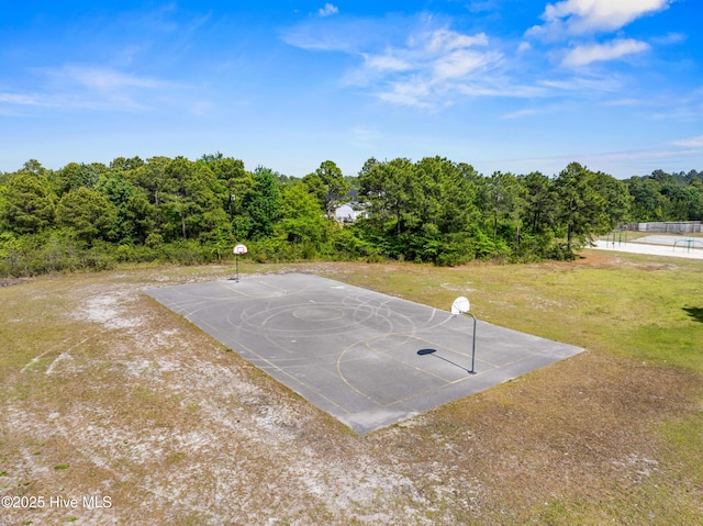 view of basketball court featuring a yard and community basketball court