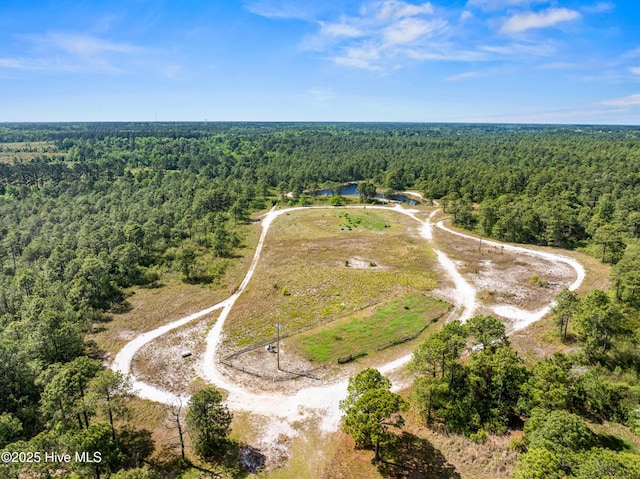 drone / aerial view with a view of trees