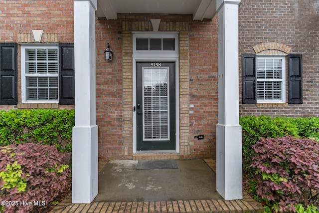 entrance to property with brick siding