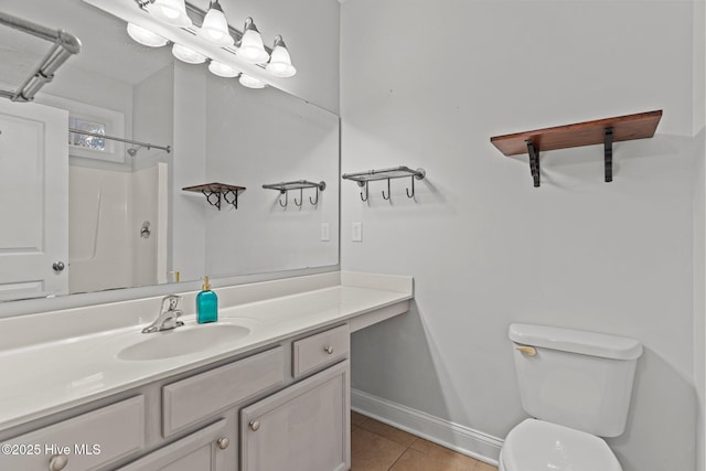 bathroom featuring tile patterned floors, toilet, baseboards, vanity, and a shower