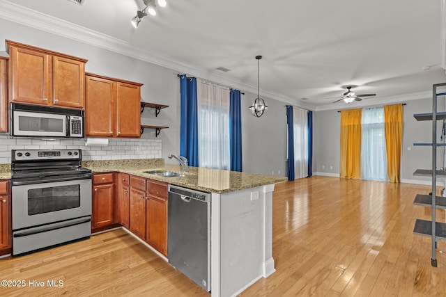 kitchen featuring stainless steel appliances, a sink, open shelves, ceiling fan, and backsplash