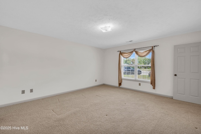 801 Plainfield Ct, Wilmington, NC 28411 - spare room featuring a textured ceiling, baseboards, visible vents, and light carpet