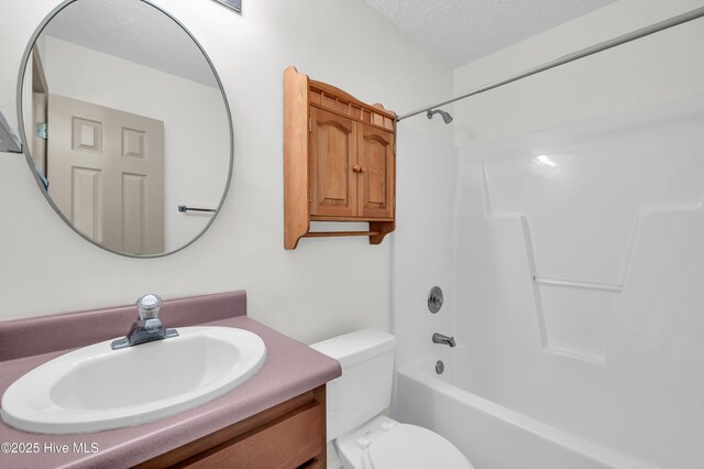 801 Plainfield Ct, Wilmington, NC 28411 - bathroom with toilet, a textured ceiling, bathtub / shower combination, and vanity