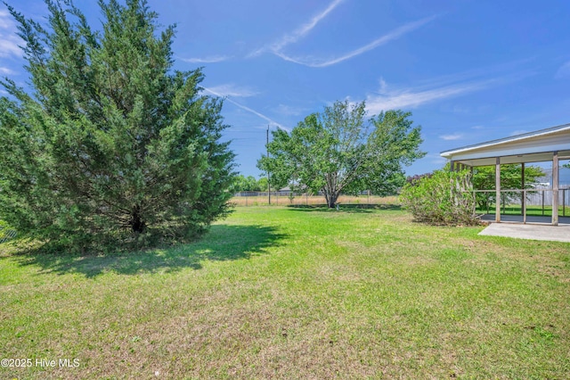 view of yard featuring a patio area and fence