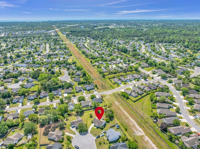 birds eye view of property with a residential view