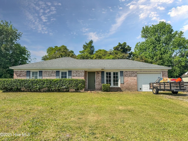 single story home featuring an attached garage, brick siding, and a front lawn