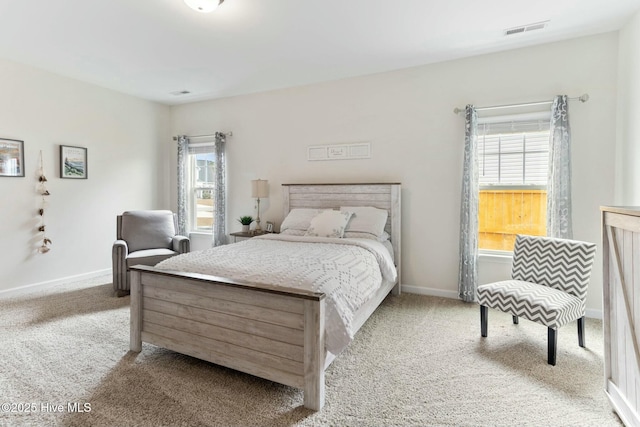 603 Coral Reef Ct, Sneads Ferry, NC 28460 - bedroom featuring baseboards, visible vents, and carpet