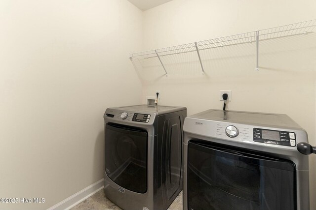 603 Coral Reef Ct, Sneads Ferry, NC 28460 - laundry room with washing machine and clothes dryer, baseboards, and laundry area