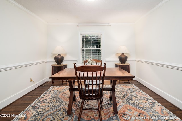 office space with ornamental molding, wood finished floors, and baseboards