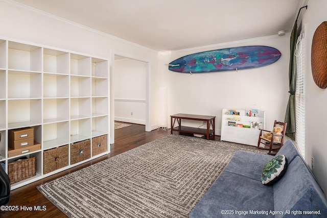bedroom featuring crown molding and wood finished floors