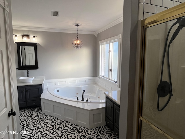bathroom with visible vents, a tub with jets, vanity, tile patterned floors, and ornamental molding