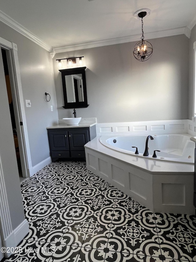 full bath featuring crown molding, an inviting chandelier, a garden tub, and vanity