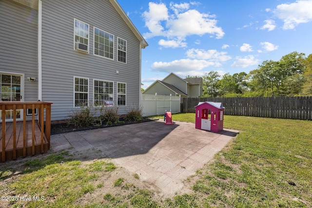 exterior space with a fenced backyard, a patio area, and a deck