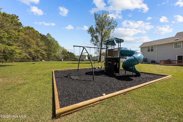 communal playground with a lawn and fence