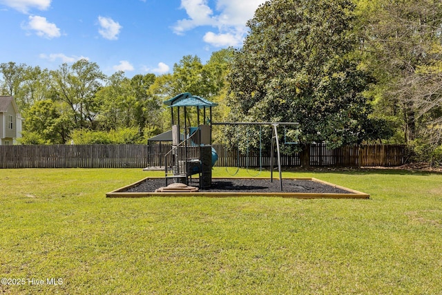 view of play area with a yard and fence