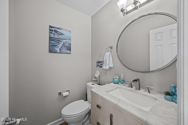 half bath with vanity and toilet