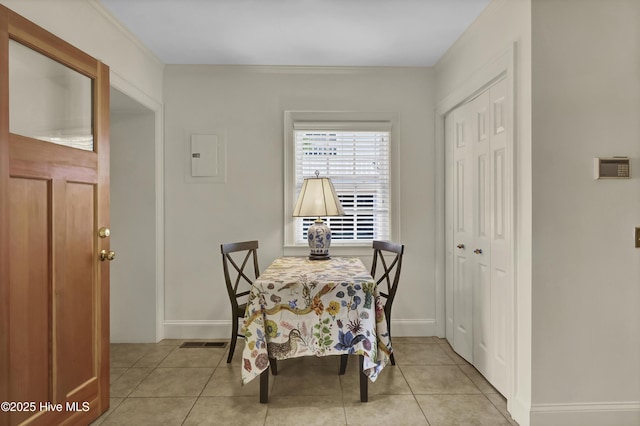 2405 Oleander Dr, Wilmington, NC 28403 - tiled dining room with visible vents, electric panel, and baseboards