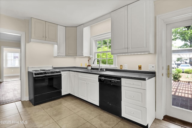 2405 Oleander Dr, Wilmington, NC 28403 - kitchen with white cabinets, dark countertops, a sink, black dishwasher, and electric range oven