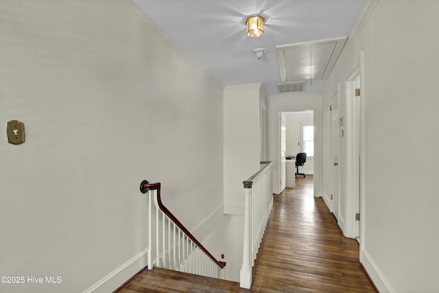 2405 Oleander Dr, Wilmington, NC 28403 - hall with attic access, baseboards, visible vents, an upstairs landing, and wood-type flooring