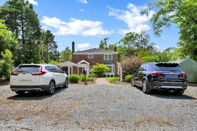 2405 Oleander Dr, Wilmington, NC 28403 - view of front facade featuring a chimney