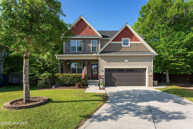 view of front of house featuring fence, a porch, a front lawn, and driveway