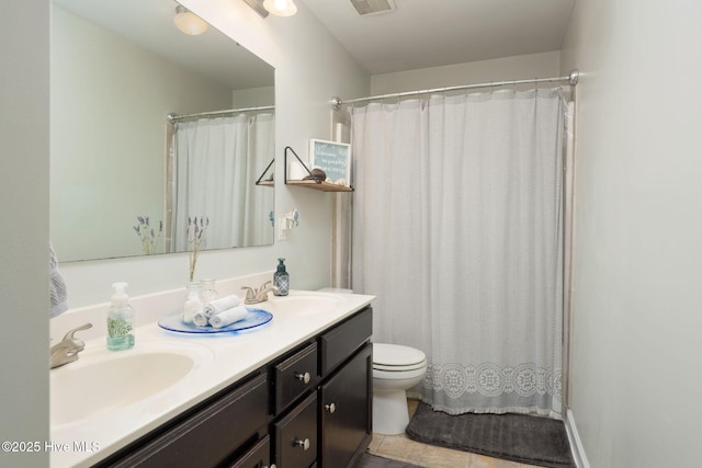 full bathroom with toilet, double vanity, a sink, and curtained shower
